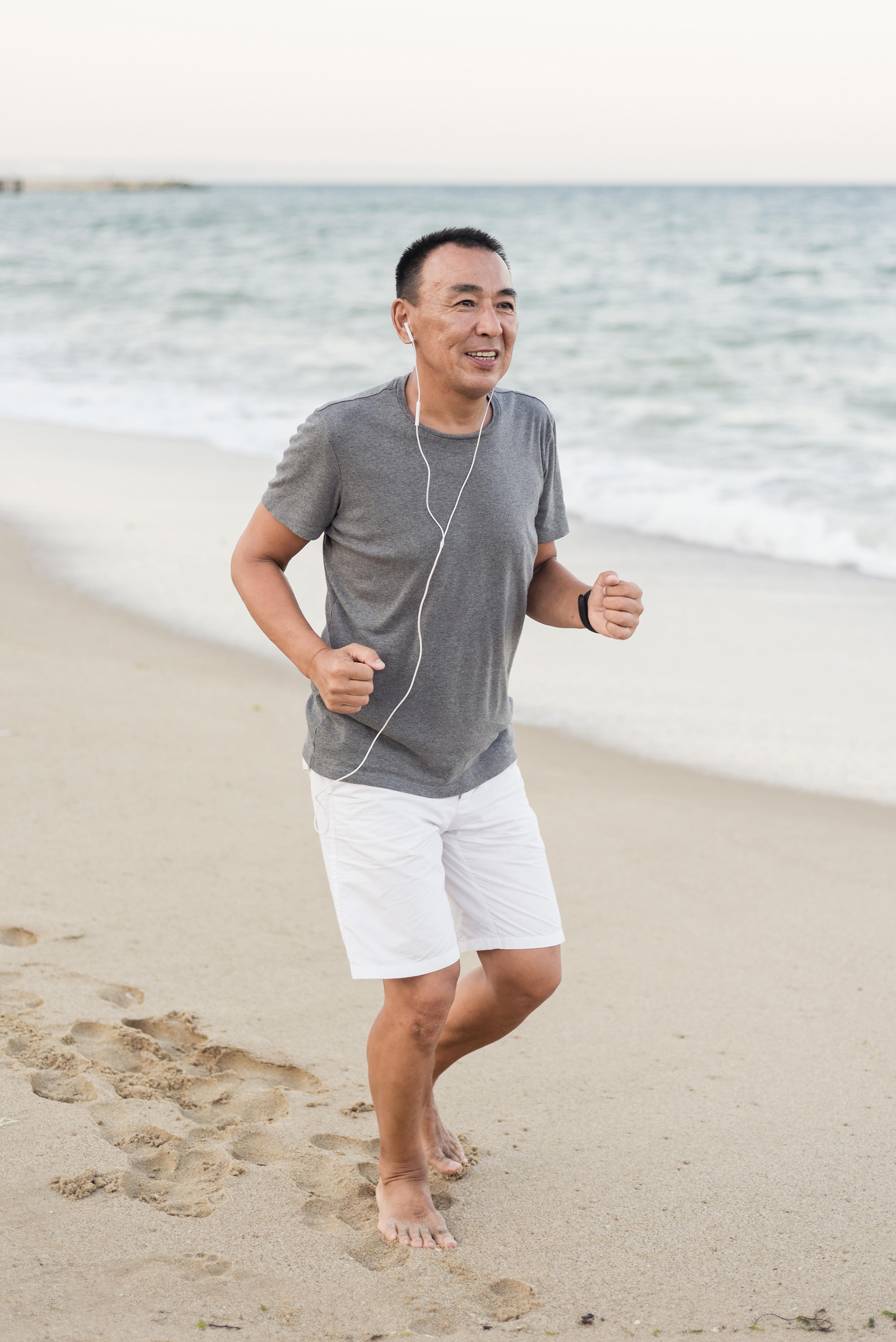 full-shot-man-running-beach